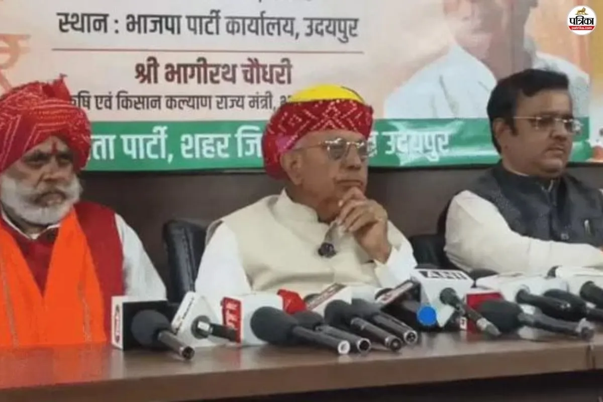 Bhagirath Choudhary at a press conference table in Udaipur