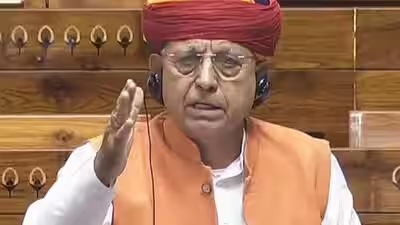 Bhagirath Choudhary speaking in the Lok Sabha, wearing a headset
